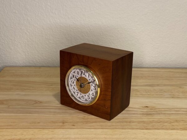 Curly Cube Clock: a small handmade wood clock from the Pacific Northwest, made from exquisite hand-selected hardwoods, a rustic modern, unique gift for any décor, holiday, or occasion. Traditional numeral design with reliable quartz movement. Side view.
