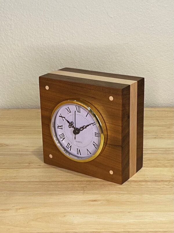 Curly Cube Clock: a small handmade wood clock from the Pacific Northwest, made from exquisite hand-selected hardwoods, a rustic modern, unique gift for any décor, holiday, or occasion. Roman numeral design with reliable quartz movement. Side view