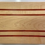 Maple with twin Paduak stripes.