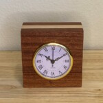 Curly Cube Clock 008 - Roman Numeral Curly Cube Clock: a small handmade wood clock from the Pacific Northwest, made from exquisite hand-selected hardwoods, a rustic modern, unique gift for any décor, holiday, or occasion. Roman numeral design with reliable quartz movement.